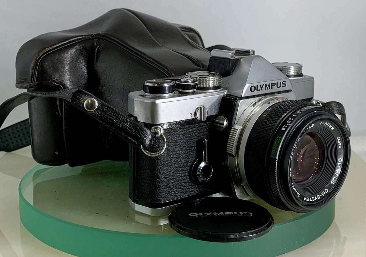 Olympus OM-1 and Pentax K1000 manual 35mm film SLRs compared