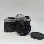 YASHICA FX-D QUARTZ 35mm FILM SLR CAMERA WITH YASHICA 50mm F/1.9 ML Lens 125