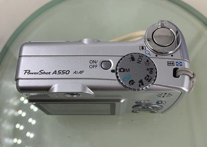 CANON POWERSHOT A550 7.1MP CAMERA WITH 1.0GB SD CARD SILVER TESTED - 8755